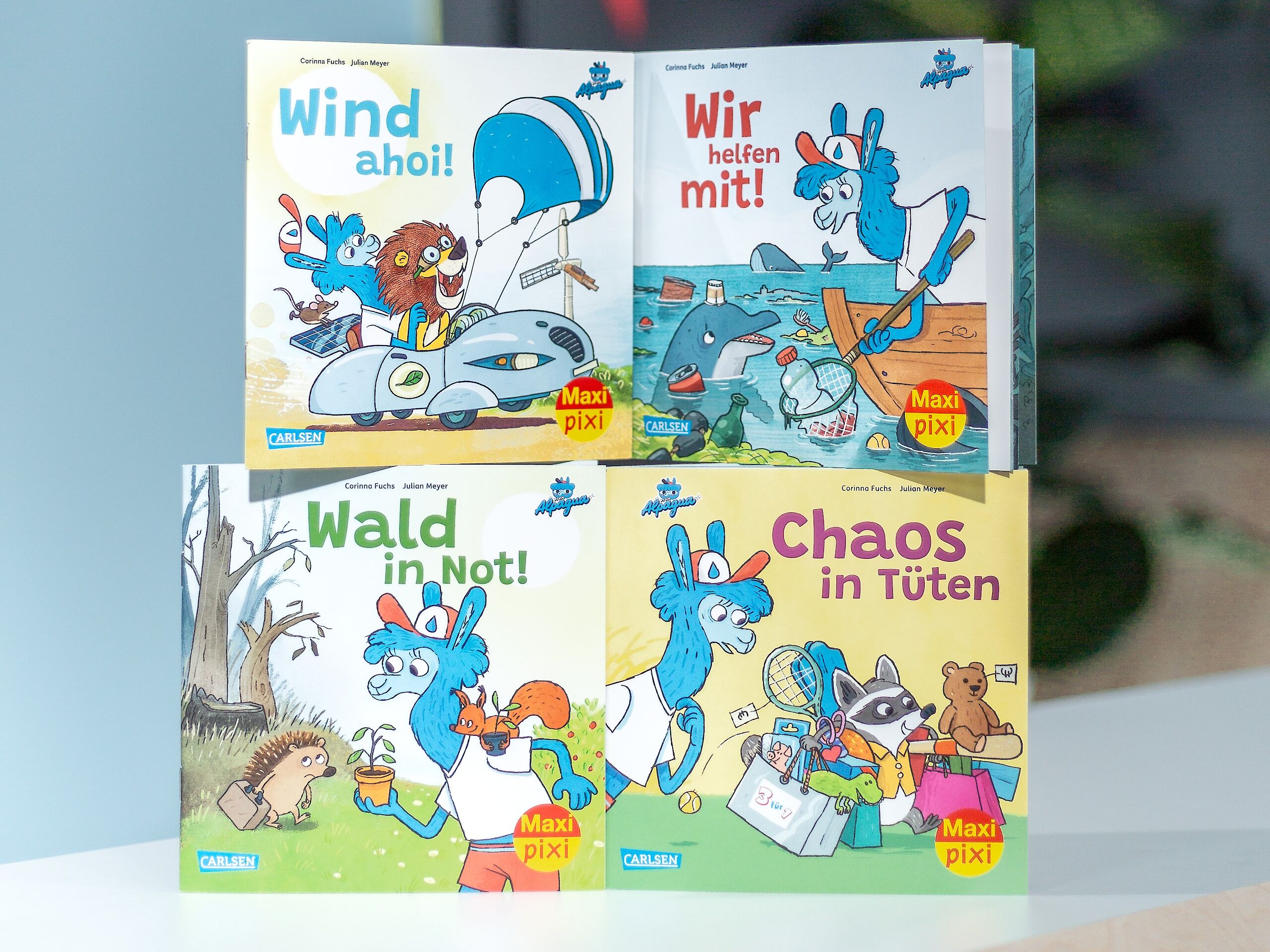 Vier Maxi Pixi Vorderseiten. Die Titel lauten "Wind ahoi!", "Wir helfen mit!", "Wald in Not!" und "Chaos in Tüten".