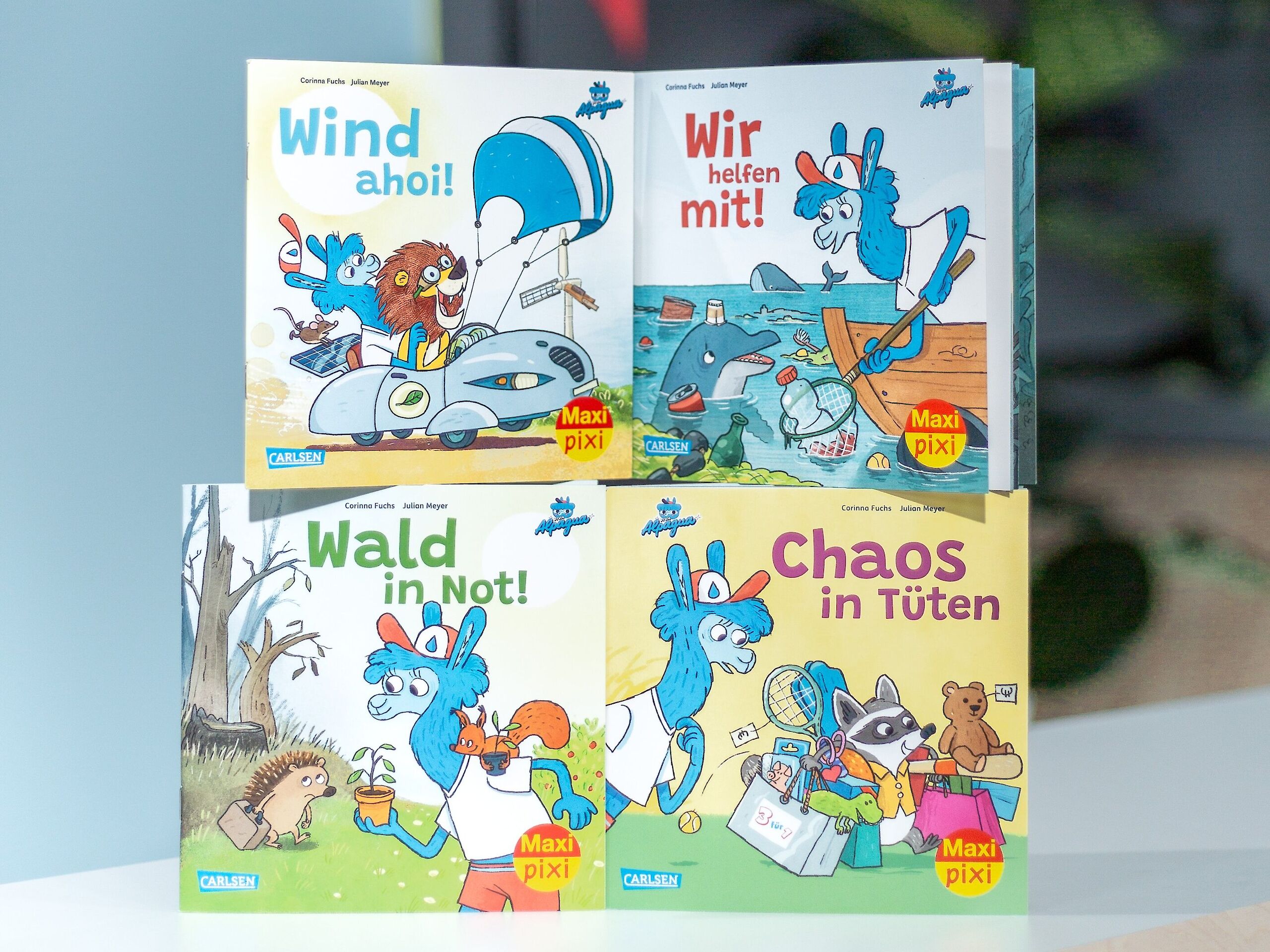 Vier Maxi Pixi Vorderseiten. Die Titel lauten "Wind ahoi!", "Wir helfen mit!", "Wald in Not!" und "Chaos in Tüten".